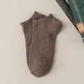 Brown low-cut cotton sport socks displayed flat on a beige leather surface background - One Size / Dark Coffee