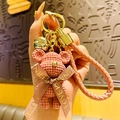 Pink woven texture space bear keychain with gold bell and PU leather wrist strap - Pink