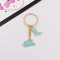 Detail view of blue cowboy hat and boot charms on a gold alloy metal keychain - 4 Blue - Gold Ring / Blue