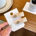 Cream marble resin spring hair clips with oval metal accent on a display card - Cream White (Pair)