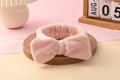 Soft pink coral fleece headband with a large bow for face washing and makeup - Dusty Pink