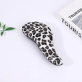 Leopard print detangling hairbrush with black bristles on a white aesthetic background - Leopard Print