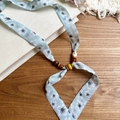 Close-up of floral print chiffon necklace with decorative wooden and acrylic beads - Necklace-Green