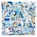 Stack of 50 blue winter cartoon stickers with watercolor penguin and snowman designs - Blue Winter Theme
