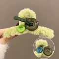 Green plush claw clip featuring decorative resin buttons for a cozy winter hairstyle - Button Style / Green
