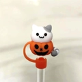 Close-up of white cat in orange pumpkin silicone straw topper for Halloween party - 10mm Single Pack / Orange Pumpkin Cat