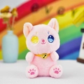Close-up of cute pink plush cat keychain with colorful eyes and a bell collar - Pink