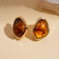 Macro detail of amber resin stud earrings with irregular gold metal trim and swirl patterns - Brown Irregular (925 Sterling Silver Earring Post)