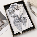 Blue and white paisley print silk scarf in ivory displayed on a luxury handbag - 70-70cm / White Paisley (FJ805)