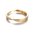 Detailed macro view of an adjustable gold ring featuring twisted bands and sparkling pavé crystals - Twisted Pave Zircon