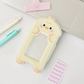 Cute yellow chick cartoon acrylic card holder and polaroid photo frame on white desk - Duck