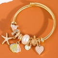 Gold stainless steel charm bracelet with starfish, shell, pearl and heart pendants - Colorful