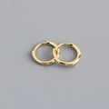 Detailed close-up of pair of polished gold sterling silver huggie hoop earrings - 8mm Inner Diameter (Gold)