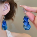 Detailed close-up of blue layered circular resin drop earrings with silver hooks - Ear Hook - Silver Blue - Shell Piece