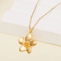 Elegant gold flower pendant necklace with matte finish and fine chain on white steps - 137513-Gold Matte Flower