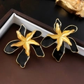 Detailed macro view of vintage black and gold flower earrings with polished enamel finish - Black Flower Style (10#)