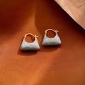 Macro shot of gold geometric earrings with light blue enamel texture on fabric - 29# Ear Buckle-Blue Pearlescent Trapezoid Bag Enamel Earrings