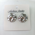 Irregular round silver earrings with hammered texture on fashion jewelry display card - Hammered Circular / Steel