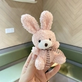 Cute pink plush bunny keychain with a brown plaid ribbon bow sitting for backpacks - Pink Rabbit