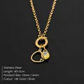 Elegante gouden roestvrijstalen ketting met hartvormige hanger en geel kristal detail - Goud / 40+5cm Kettinglengte / Letter C
