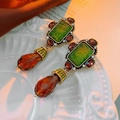 Close-up of vintage gold earrings with green gemstones and amber teardrop pendants - Silver Earring Post - Coffee