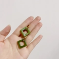 Detail view of green resin square drop earrings with gold titanium steel hoops - Square Elegant Green (Gold Hoop)