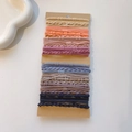 Detailed view of high-elastic multi-colored braided hair ties on minimalist card packaging - Bamboo Texture Purple Color Set / 32 Pieces