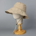 Detail view of khaki sun hat with wide brim, adjustable windproof chin strap on mannequin - Khaki