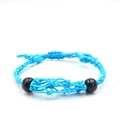 Detailed view of royal blue braided rope necklace with adjustable knots and black beads - Bracelet / Blue