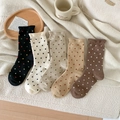 Elegant polka dot wool socks for women in five warm colors displayed on cozy fleece background - One Size / Mixed Colors
