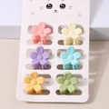 Detail of 6-piece matte flower hair claws in colorful pastels on a jewelry card - Flower Style / 6-Piece Set