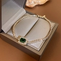 Close-up of emerald green geometric stone bracelet with pavé zircons in luxury jewelry box - Green Square
