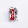 Close-up of a red enamel and silver alloy Christmas pendant for DIY jewelry designs - Red Enamel Curved Pendant