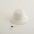 Close-up of beige cotton kids bucket hat with adjustable windproof drawstring and small label - 50cm (1-3 Years) / White