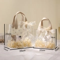 Detailed size comparison of PVC daisy gift bags with dimensions and ribbon decoration - Small Beige Daisy / Without Bow
