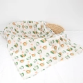 White bamboo cotton swaddle blanket with animal print draped over a woven basket - 120*120cm / African Zoo-Bamboo Cotton Muslin