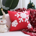Red Christmas pillowcase with white snowflake patterns on a cozy white sofa setting - Red Linen Towel Embroidered Snowflake/Red