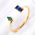 Detail of adjustable gold-plated ring featuring rectangle blue and marquise green gemstones - US 6 / Blue and Green