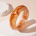 Macro shot of retro acrylic resin bracelet with amber texture and striped patterns - Light Coffee Faceted Bangle (89#)