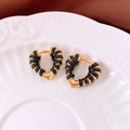 Detail of 18k gold heart hoop earrings with black woven wrap on white ceramic plate - Heart Ear Buckle (Real Gold Plating) / Black