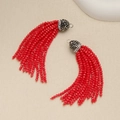 Macro detail of red beaded tassels with rhinestone metal caps for jewelry making - Red