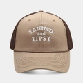 Close-up of Tanned and Tipsy embroidery on a breathable beige and brown trucker hat - Khaki and Coffee Brim