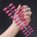 Detailed view of rose pink glossy coffin nails held by hand on black background - Glossy Rose Pink (JJL-32)