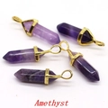 Five hexagonal amethyst crystal pillars with gold-tone caps and metal loops - Amethyst