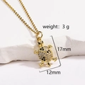 Detail shot of a golden turtle pendant with white crystals and heart accents - Gold Turtle Delicate Version (Style 9 Gold)