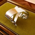 Detailed view of silver geometric wide cuff bracelet on a luxury texture display - Silver Multi-layer Geometric Crossed Style