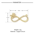 Detail view of infinity butterfly charm connector with zircon inlays and copper gold plating - Gold Infinity Butterfly Charm