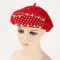 Close-up of red cashmere beret with hand-sewn pearls and rhinestones on a mannequin - Bright Red
