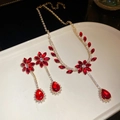 Luxurious gold necklace and teardrop earrings set with red zircon floral design - Gold-Red