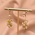 Elegant gold drop earrings featuring natural white pearls and petal metal accents - Grape Cluster Pearl Flower Drop Earrings